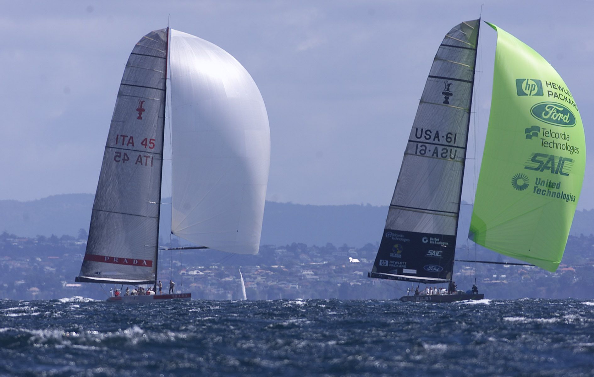 AmericaOne leads Prada yacht Luna Rossa on the final run in the sixth Louis Vuitton Cup race on the Hauraki Gulf. Photo / Peter Meecham, New Zealand Herald.
