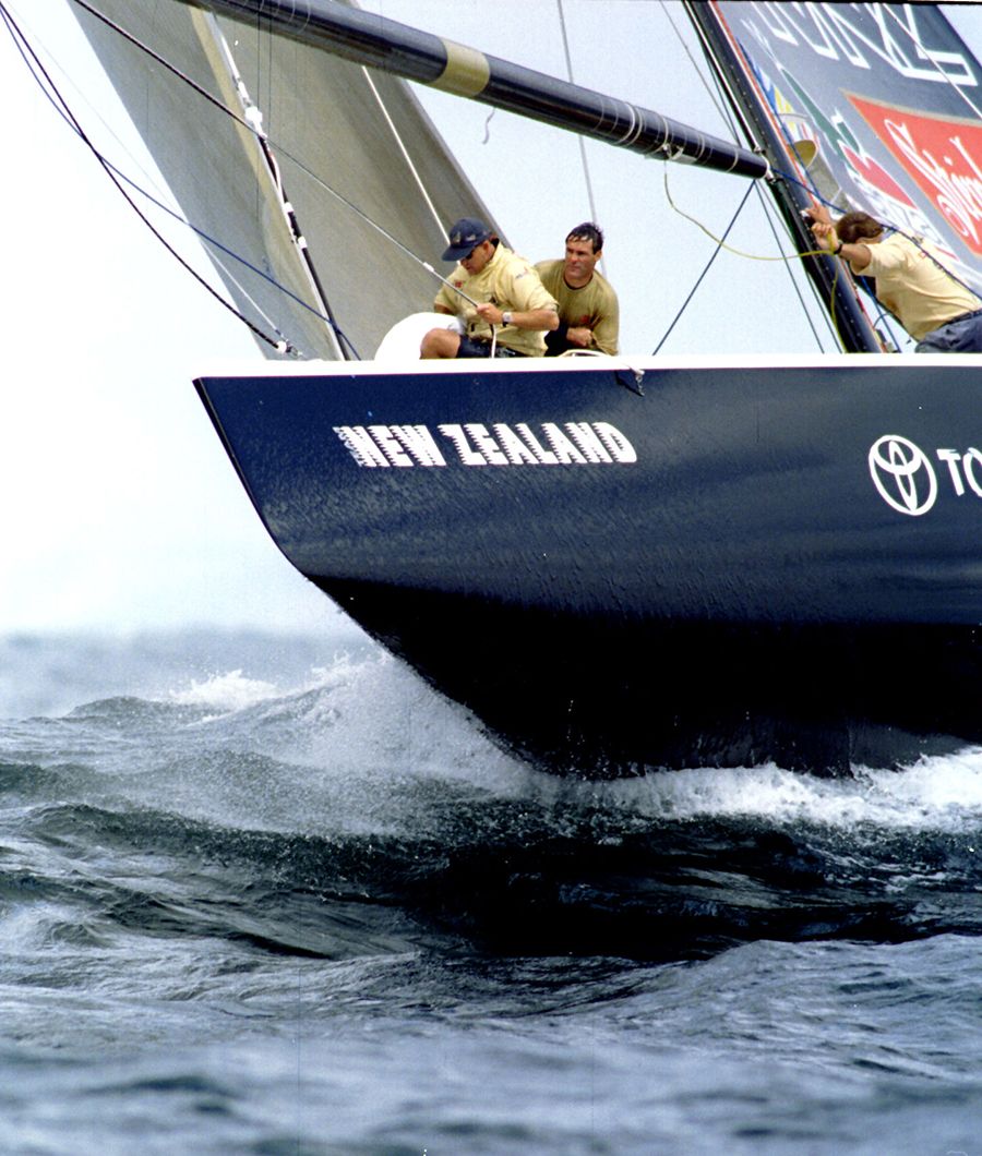 Boat Black Magic plowing through the waves during the first race of the America's Cup finals in 1995. New Zealand Herald photograph by David White.