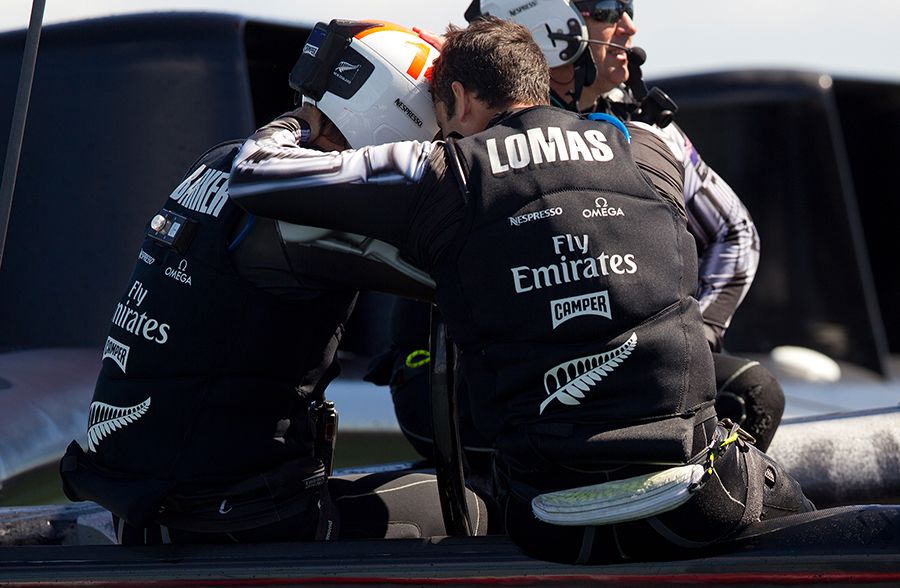 Team New Zealand skipper Dean Barker is consoled by Jeremy Lomas after losing to Oracle Team USA in the final race of the 2013 America's Cup. New Zealand Herald Photograph by Brett Phibbs