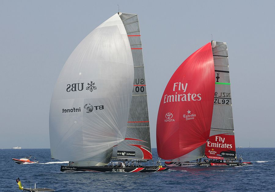 Team New Zealand makes ground against Alinghi as they run down to the bottom mark in race two of the America's Cup in Valencia, Spain. New Zealand Herald Photogrph by Mark Mitchell