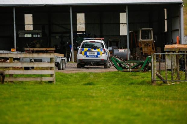 Police at a farm in Raetihi on Sunday after three people were confirmed to have died in a vehicle submerged in a farm pond. Photo / Lewis Gardner