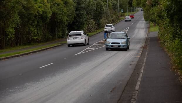 Concrete slurry has splattered down the length of Meola Road, Pt Chevalier. Photo / Sylvie Whinray