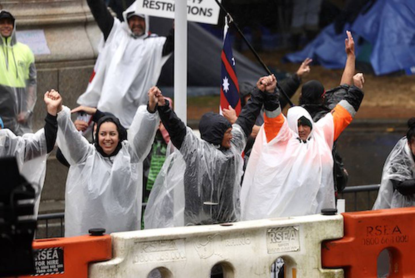 Protesters in the rain on Sunday morning. Photo / George Heard