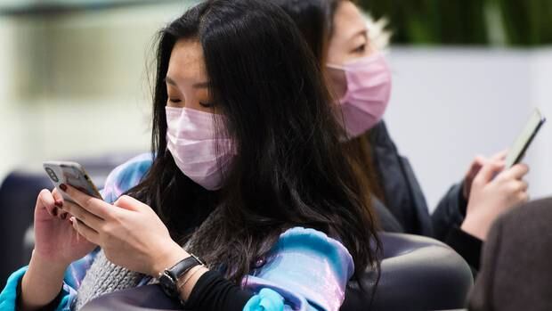 Auckland Airport staff have been told the risk of a coronavirus outbreak is low but haven't been told by what criteria the decision was made, a worker says. Photo / AP