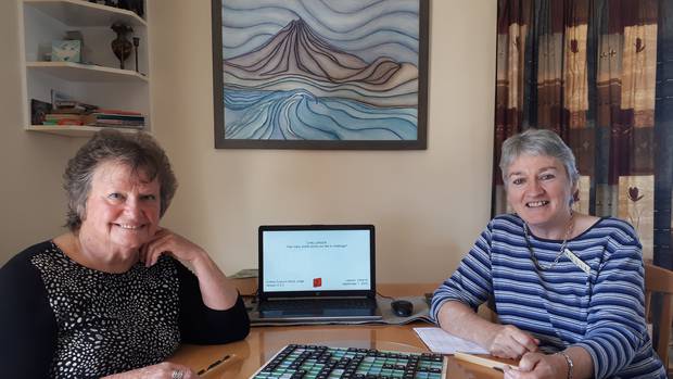 Lynne Butler (left) challenges Rosie Cleary to a game of Scrabble for fun before they meet each other in competition this weekend. Photo / Jesse King