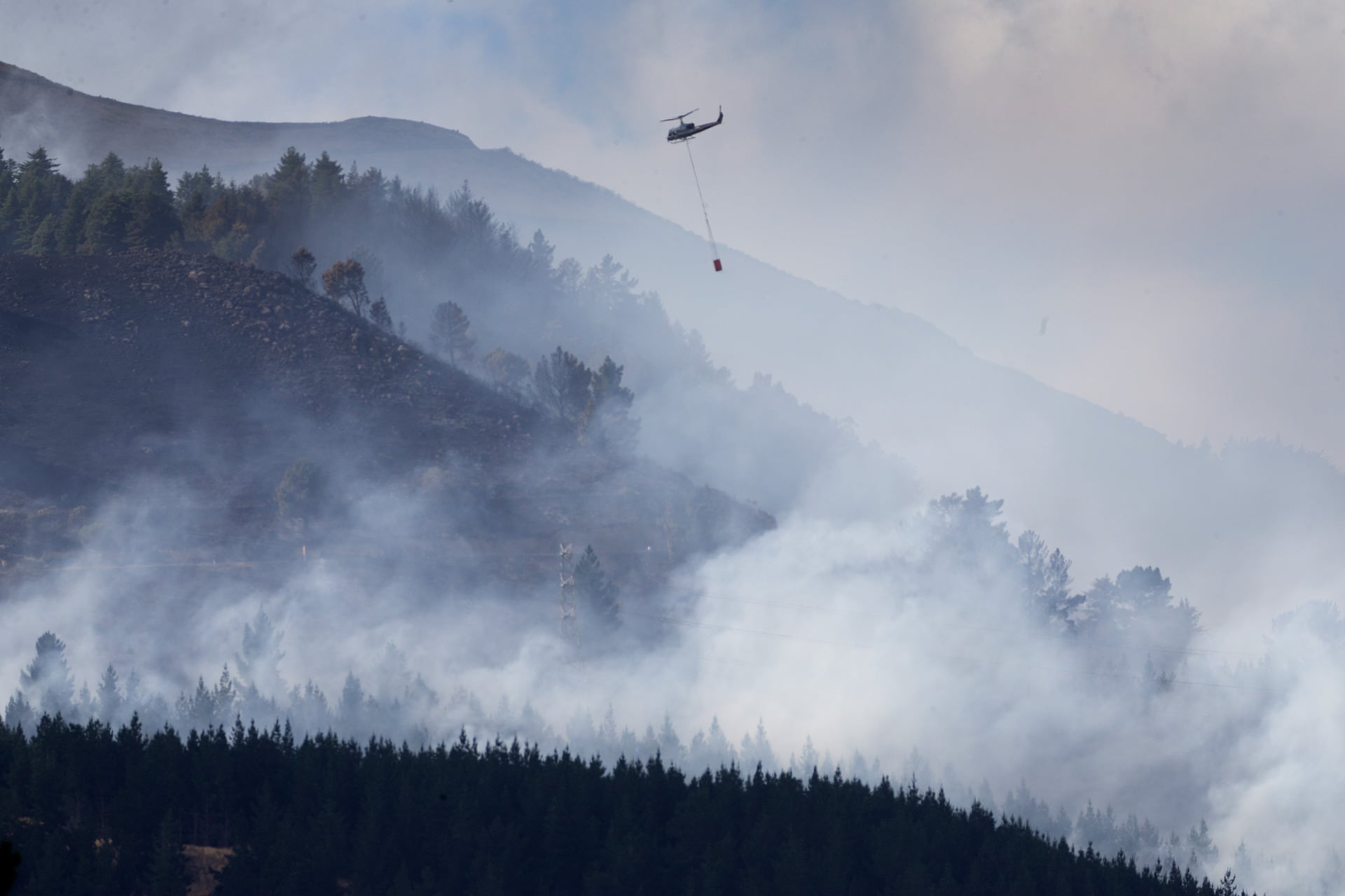 Wildfires like that which blazed through Canterbury's Port Hills in 2017 are predicted to become more frequent in a New Zealand warmed by climate change. Photo / Alan Gibson.