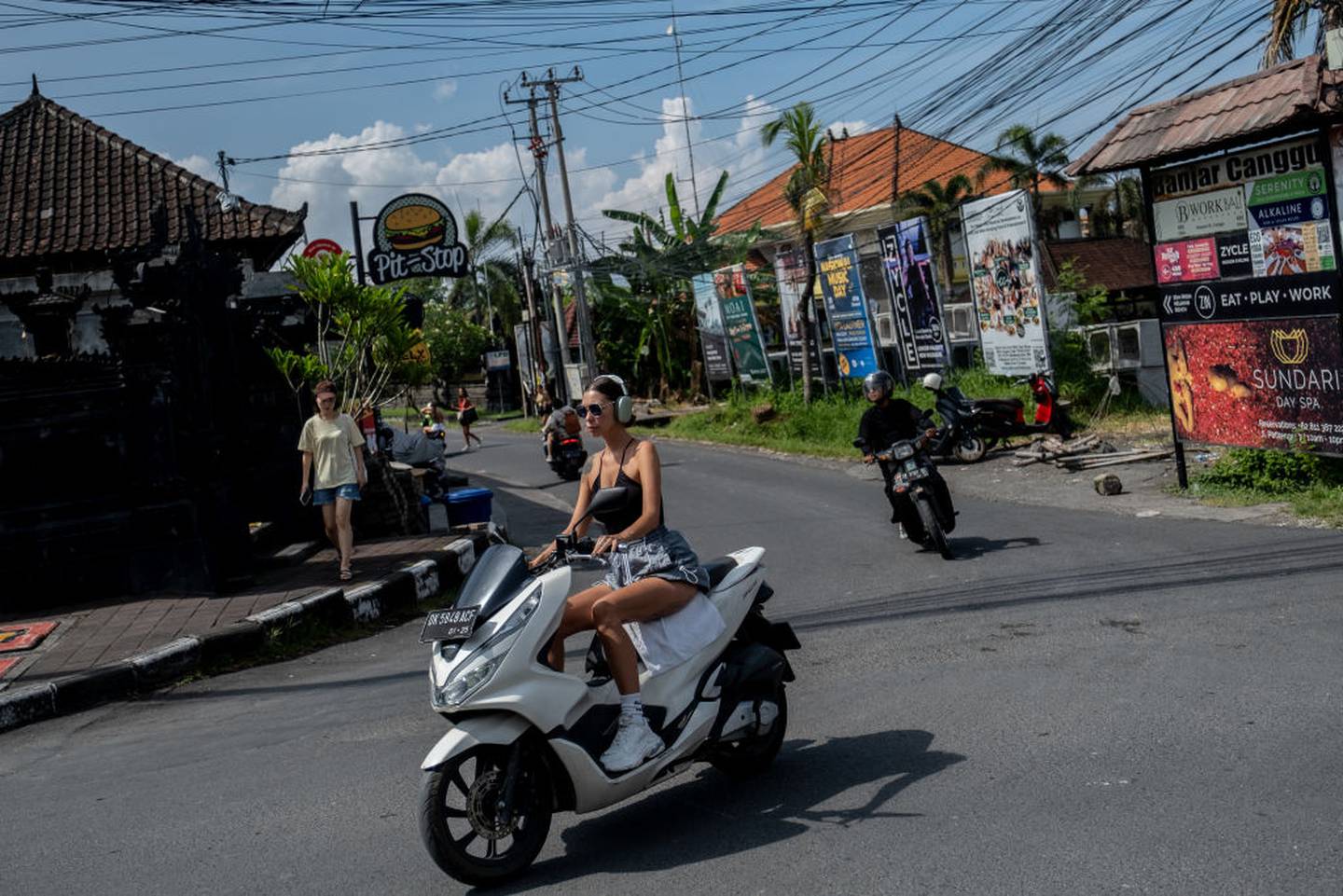 Bali leaders and authorities are sick of tourists not obeying their laws and local customs, such as riding a motorcycle without helmet. Photo / Agunng Parameswara, Getty Images