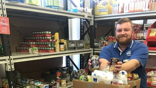 City Mission Whanganui's Justin Mulligan with some of the food donated during The Village Snob's Coffee for a Can campaign.