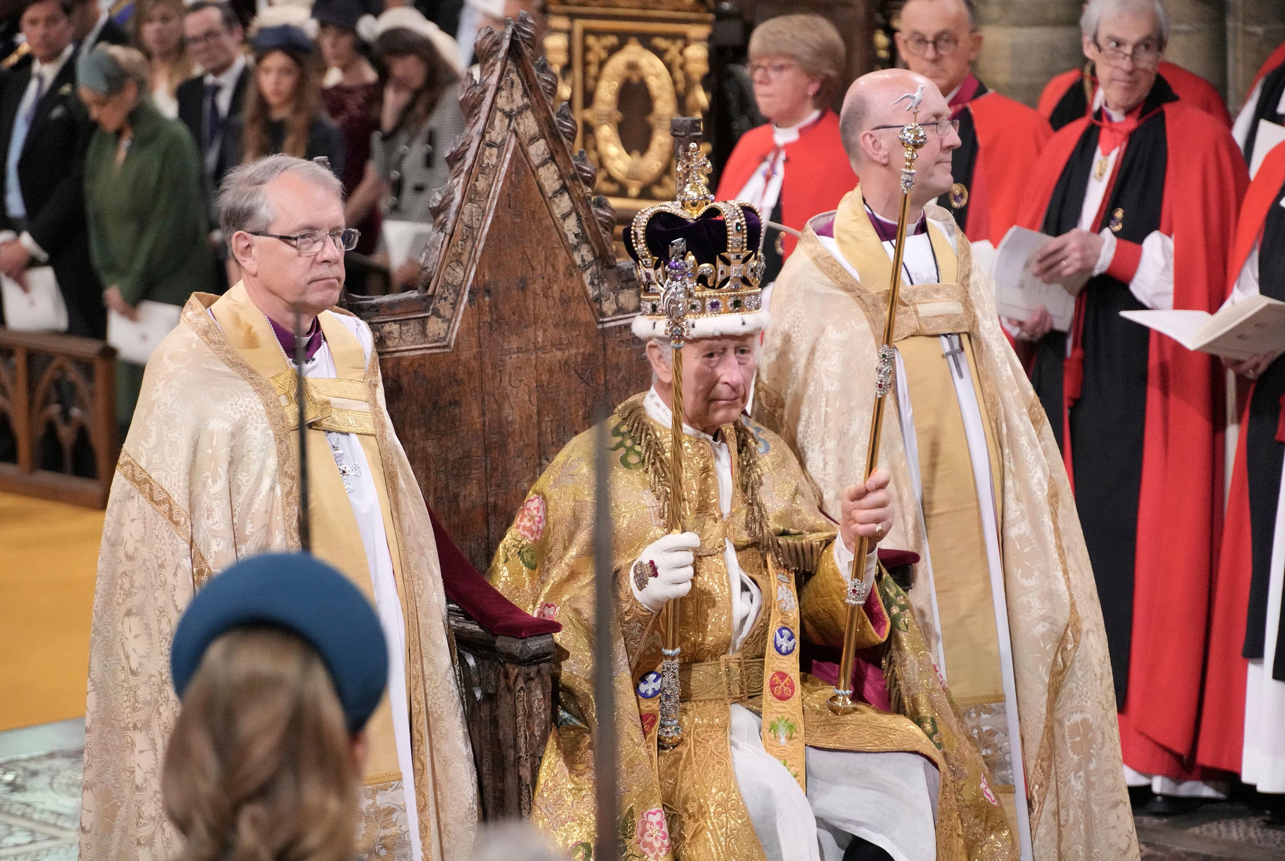 King Charles III sits as he was crowned with St Edward's Crown