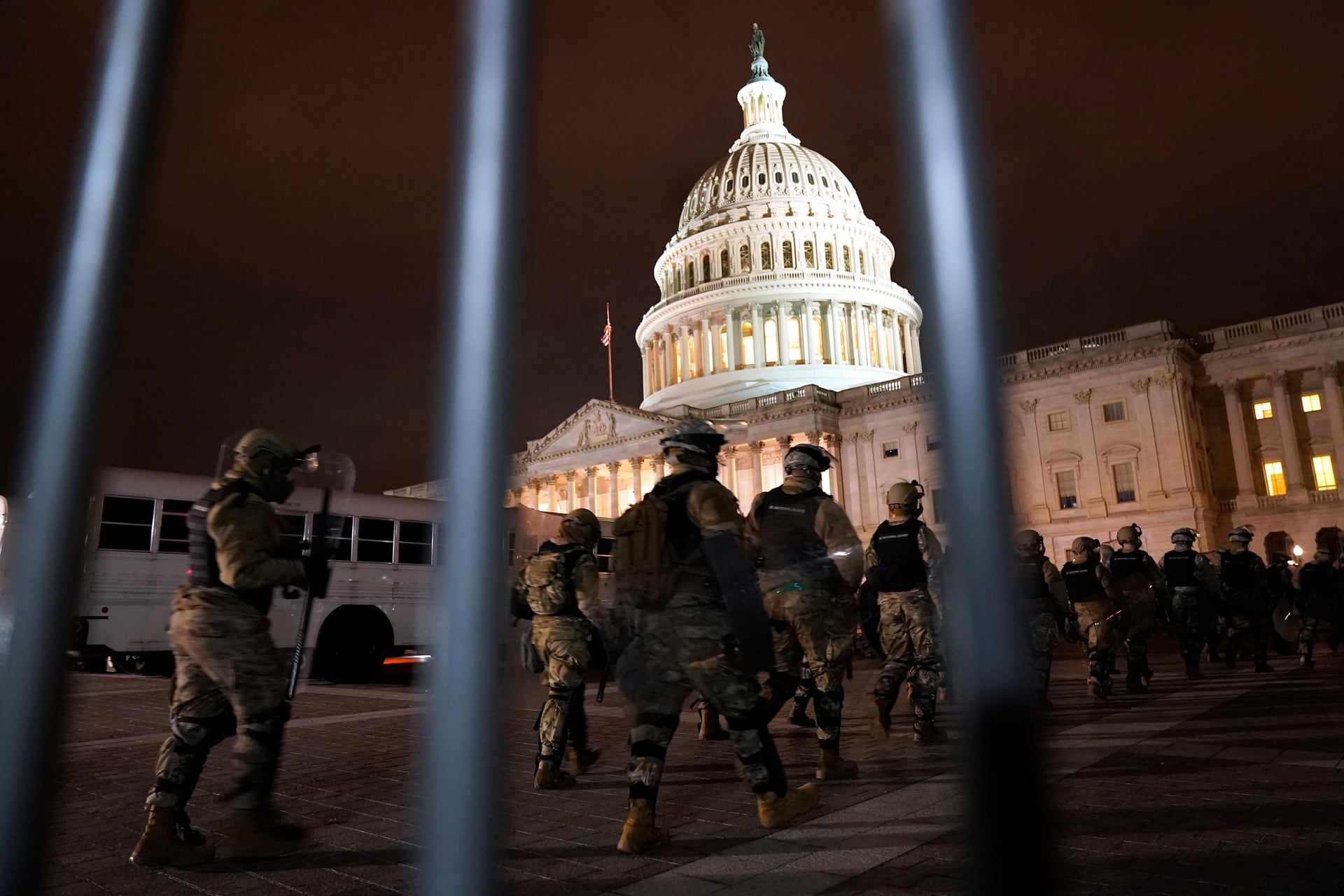 Members of the National Guard arrive to secure the area outside the US Capitol. Photo / AP