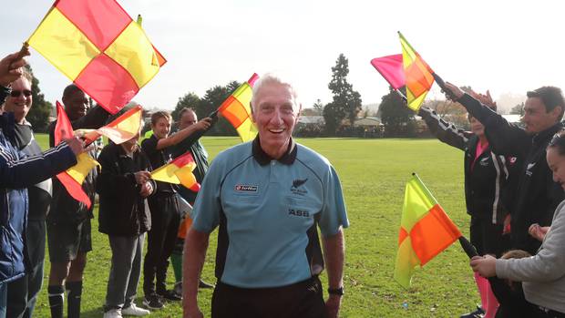A guard of honour was formed to mark Bill Tanner's 50 years as a football referee. Photo/ Bevan Conley 