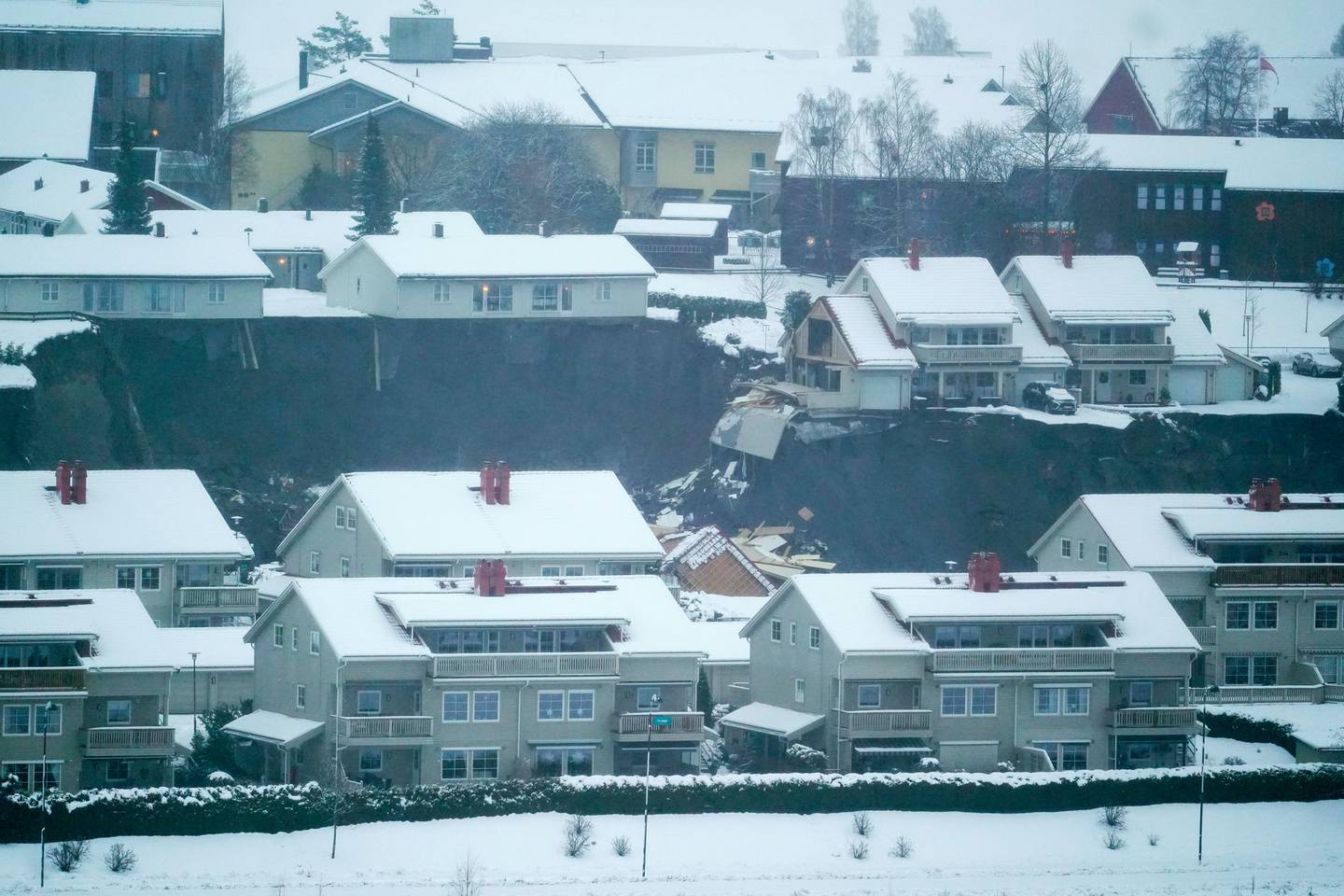 At least eight homes were destroyed in the landslide. Photo / AP