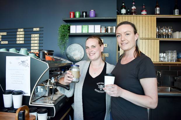 Tash May (left) and Mell Anderson (owner) from Cartel HQ, with new reusable and recyclable cup options. Photo / Laura Wiltshire 