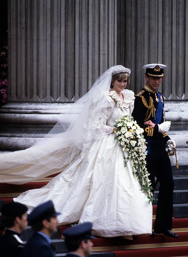 Princess Diana's wedding dress was in true 80s-style with puffy-sleeves, a dramatic 7.62m train and several layers of silk taffeta encrusted with over 10,000 pearls. Photo / Getty Images