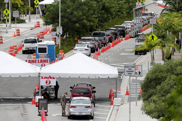 Vehicles wait in line at a Covid-19 testing site at the Miami Beach Convention Center during the coronavirus pandemic in Miami Beach, Florida. Photo / AP