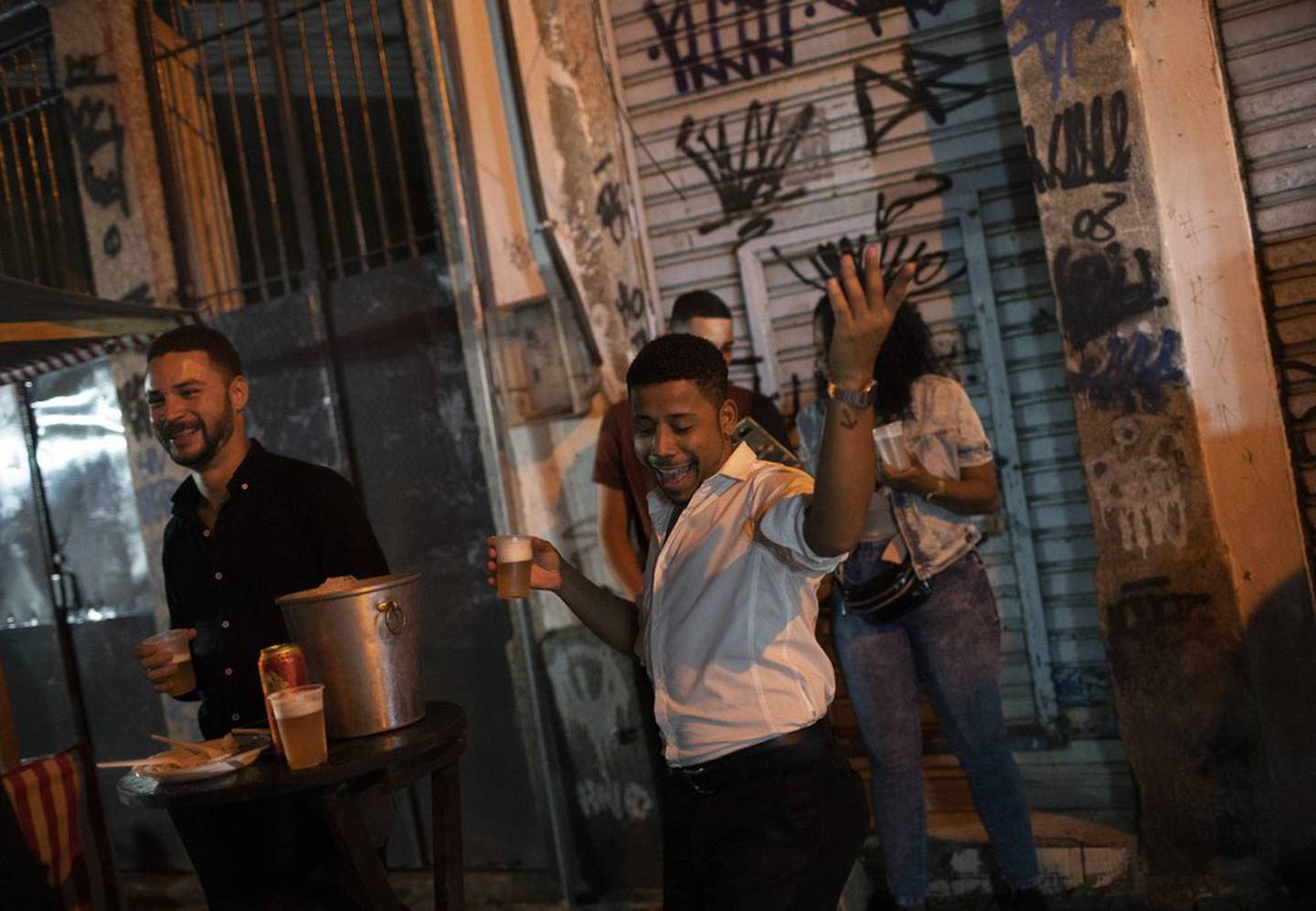  A man dances during a street performance as restrictions are eased. Photo / AP