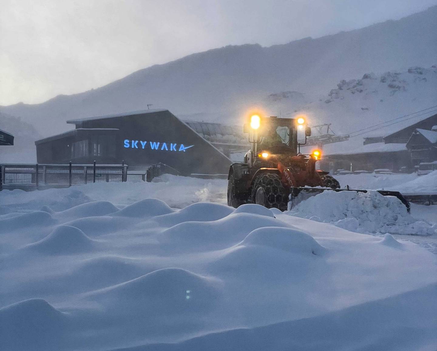 A snow plough clears a path near the Sky Waka gondola base on Whakapapa Ski Field on Mt Ruapehu. Photo / Mac Madsen