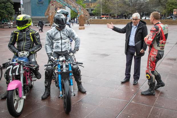 Moto track bike enthusiast Rick Ford talks with Ray Calcutt, senior Health and Safety advisor for Events at Regional Facilities Auckland, in Aotea Square. Photo / Greg Bowker
