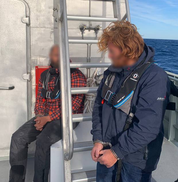 A 33-year-old New Zealand man and a 35-year-old with dual UK/South African citizenship were arrested. Photo / AFP