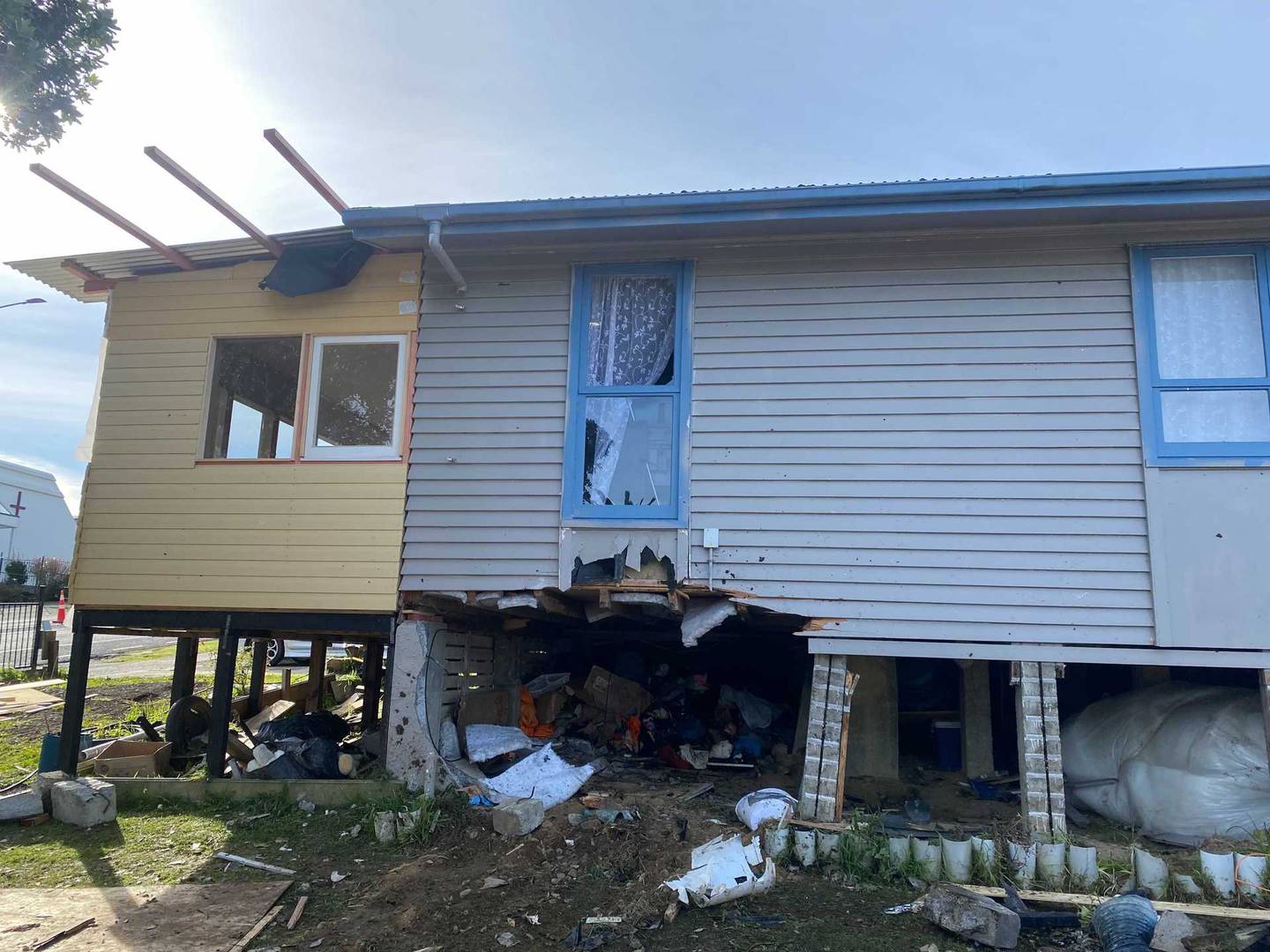 Two people died after a car crashed into a house on Warspite Ave in Porirua. Photo / Nick James