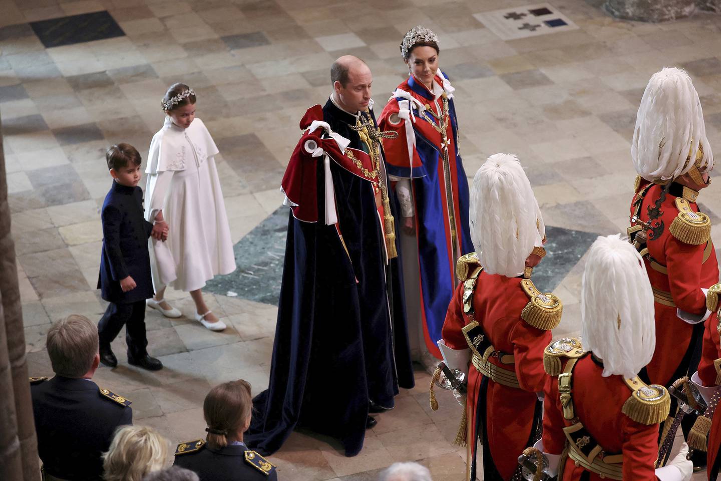 Britain's Prince William and Kate, Princess of Wales, followed by Princess Charlotte and Prince Louis, arrive at the coronation of King Charles III at Westminster Abbey, London. Photo / AP