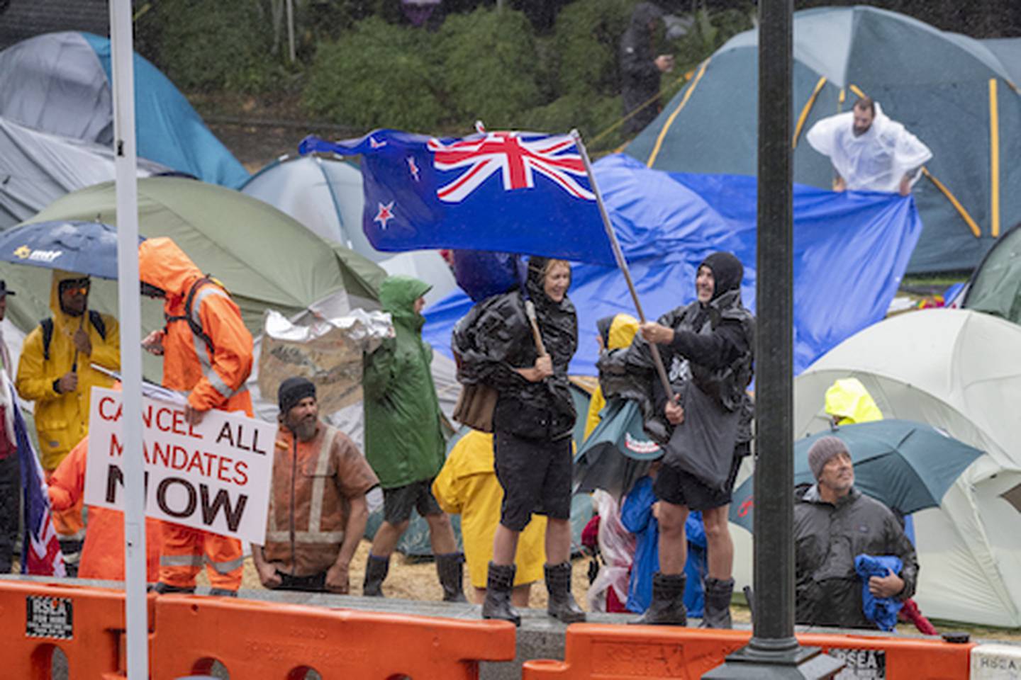 Protesters braving wet conditions during the anti-vax, anti-mandate and anti-Government protest and occupation at Parliament in Wellington. 13 February, 2022. Photo / Mark Mitchell