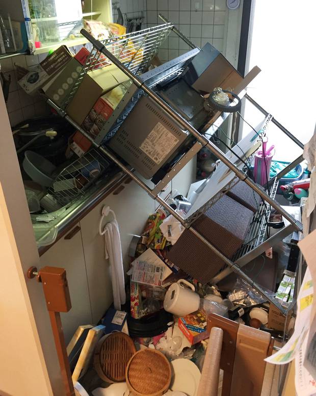 Scattered objects lie in the kitchen of a damaged house in Osaka, following an earthquake. Photo / AP