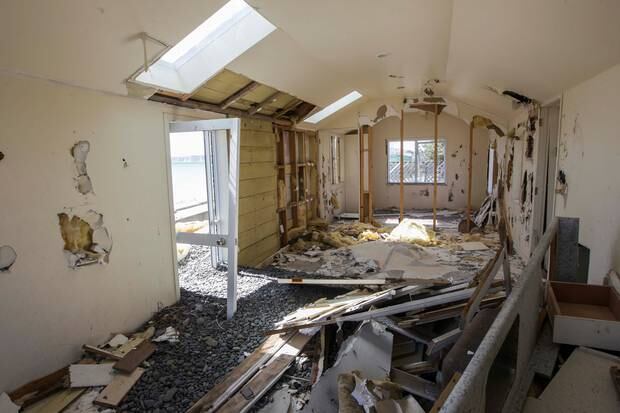 An abandoned property has given way to the elements along the Cape coast. Photo / Paul Taylor