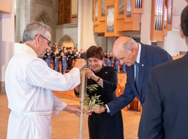 NZ Governor-General Dame Patsy Reddy places a memorial branch on the Tree of Life at the Erebus crash memorial service. Photo / Peter Meecham