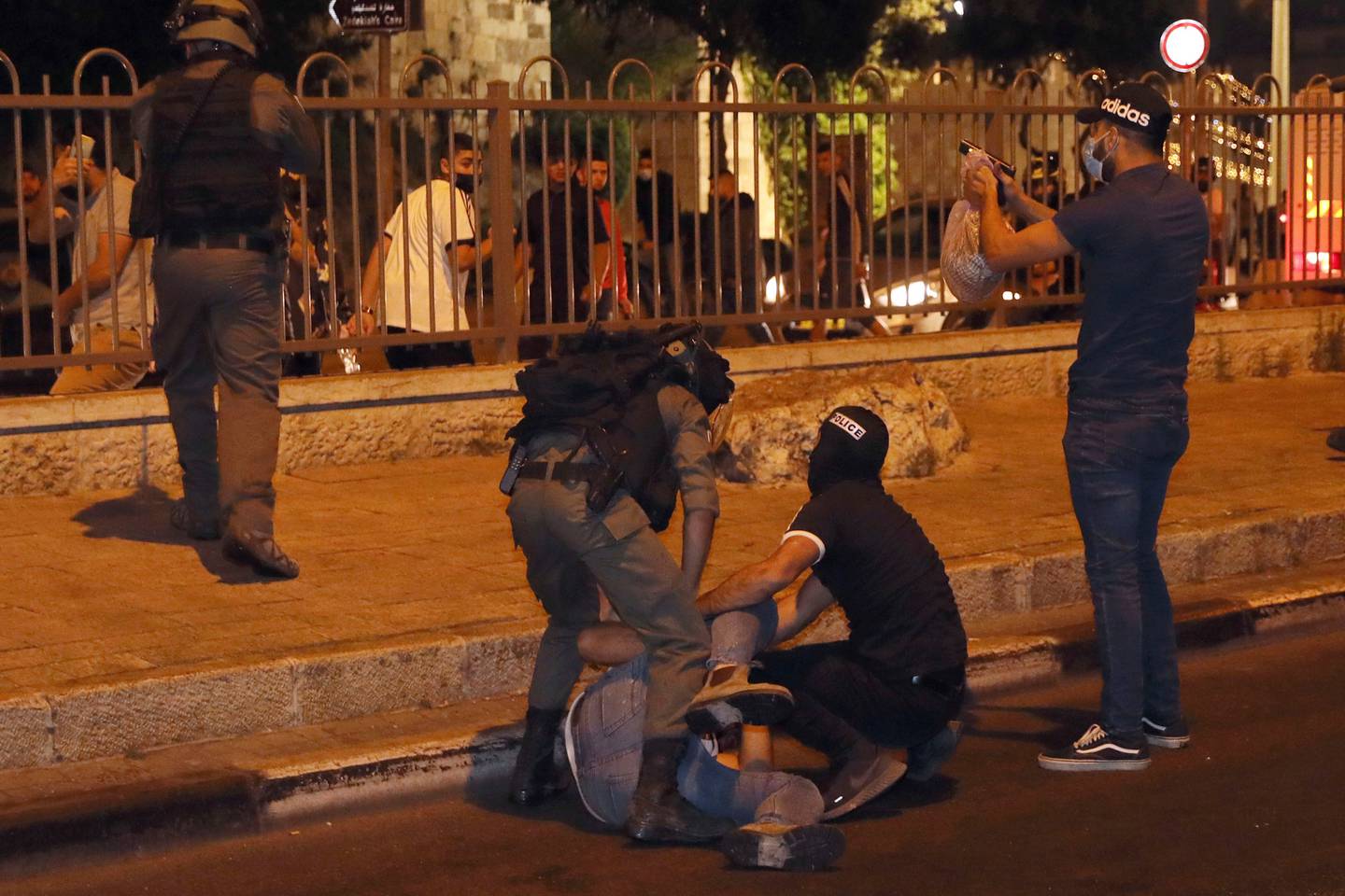 Israeli security forces arrest a Palestinian man near the Damascus Gate to the Old City of Jerusalem. Photo / AP