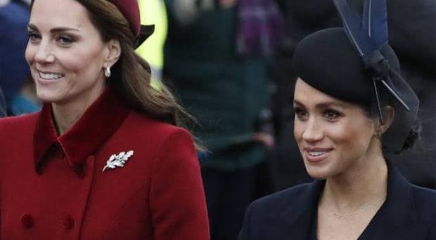 Britain's Kate, Duchess of Cambridge and Meghan Duchess of Sussex arrive to attend the Christmas Day service in Sandringham. Photo / AP