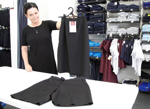 Robyn Voullaire, the manager at Andersons' uniform shop, shows off the skirt and shorts seniors at Whanganui High School will start wearing.