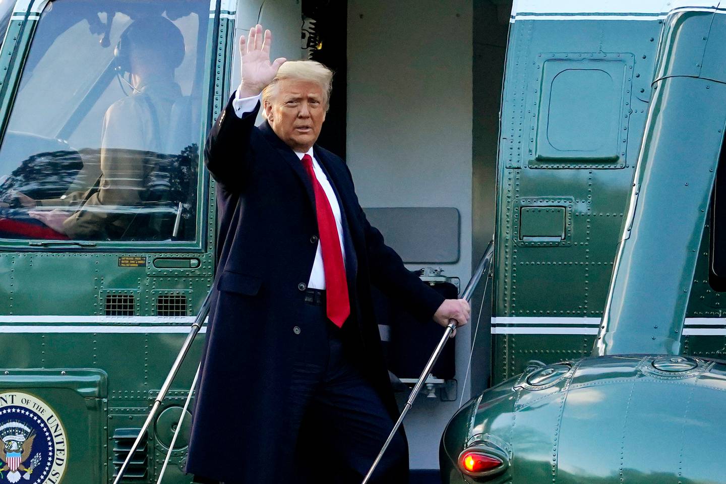 Donald Trump waves as he boards Marine One on the South Lawn of the White House. Photo / AP
