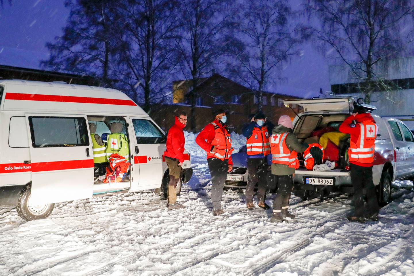 Rescue personnel arrive at the scene. Ten people are injured and 21 are missing after the landslide. Photo / AP