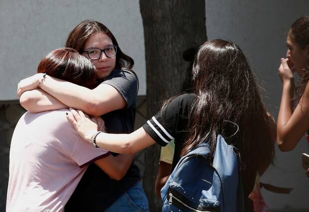 Relatives of passengers of a missing military plane comfort each other as they arrive at the Cerrillos airbase in Santiago, Chile. Photo / AP