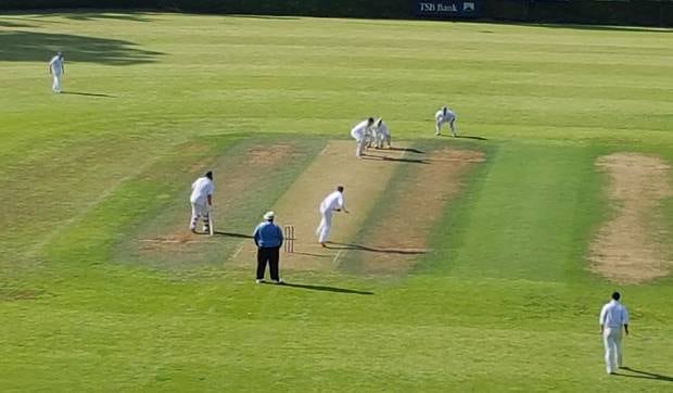 Wanganui's Chris Sharrock bowling to Taranaki's top scorer Josh Borrell on a picturesque Saturday at Pukekura Park.