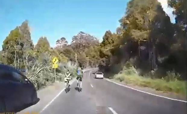 A motorist stuck behind two cyclists on a narrow West Auckland road has blasted the riders for their rude and 