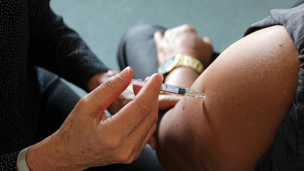 A man receives an influenza vaccination. Photo / File