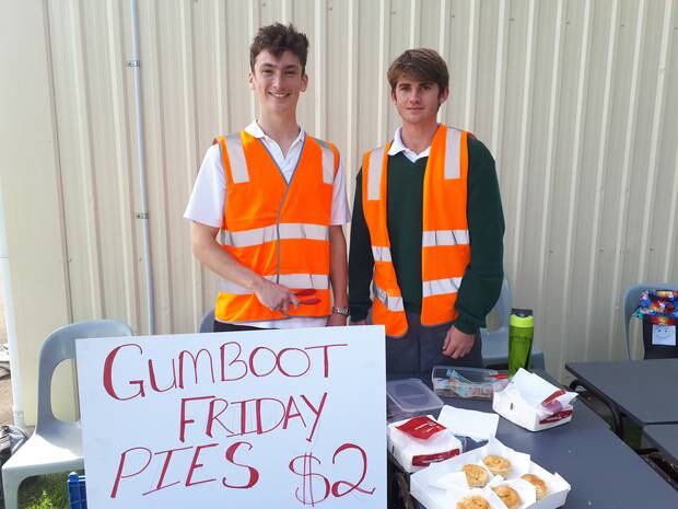 Alex Nevil, 16 and Patrick Madder, 17 looked after the pies and collected the money for the Gumboot Friday fund. Photo / Jesse King