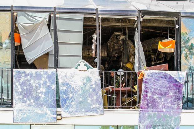 Security forces inspect the scene after a blast targeting The Kingsbury hotel in Colombo. It was one of three hotels targetted in the co-ordinated attacks. Photo / AP