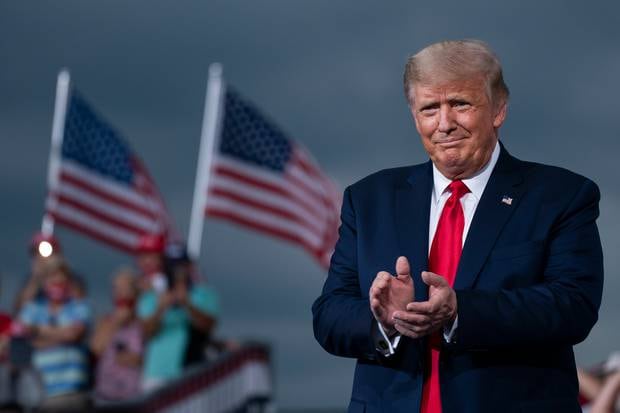 President Donald Trump arrives to speak at a campaign rally at Smith Reynolds Airport. Photo / AP