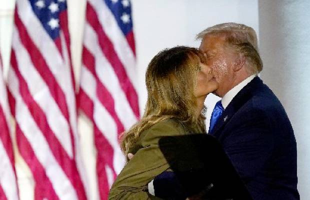Donald Trump embraces his wife Melania after she gave a speech at the 2020 Republican National Convention from the Rose Garden of the White House today. Photo / AP