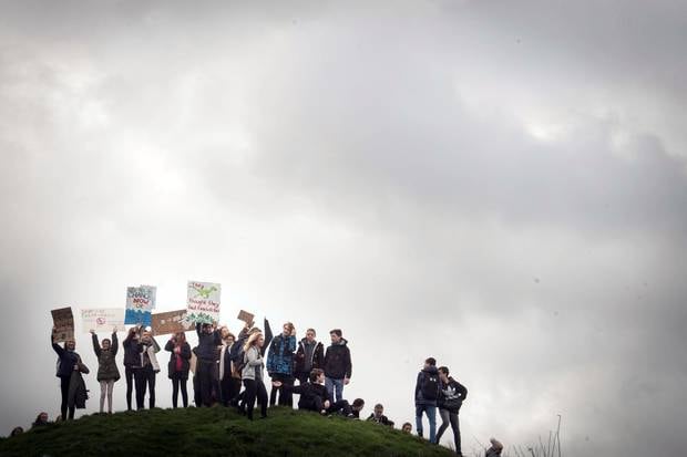 Students take part in a global protest for climate change in Cambridge city centre, England, earlier this month. Photo / Stefan Rousseau/PA via AP