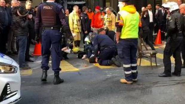 A large crowd surrounded Mert Ney as police arrested him in central Sydney yesterday. Photo / Twitter