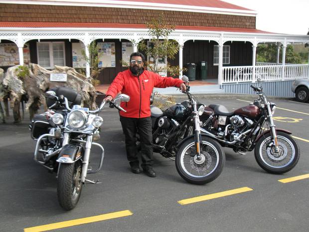 Harley enthusiast Greg Ogg poses with old-school models. Photo / Supplied.