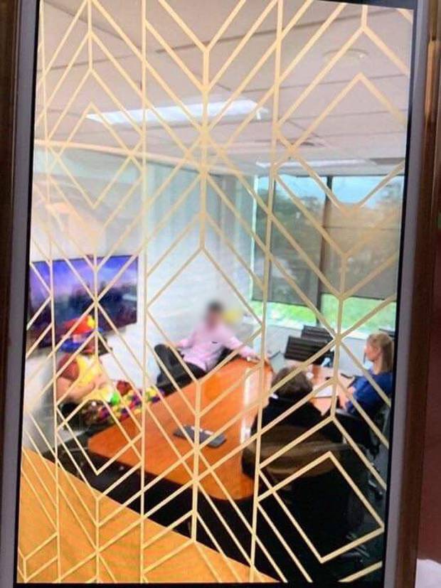 The image sent into the Herald shows the meeting taking place. The face of the staffer has been blurred to protect his identity. Photo / Supplied