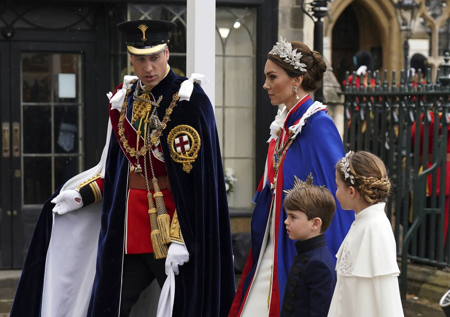 The Prince and Princess of Wales with Princess Charlotte and Prince Louis make their way into the King's coronation ceremony. Photo / AP