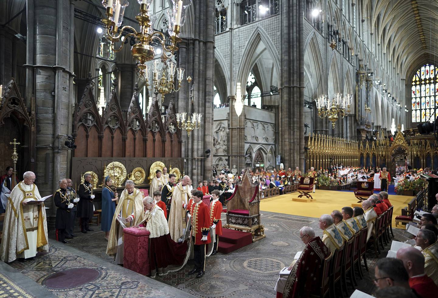 King Charles III kneels during the coronation ceremony at Westminster Abbey, London.