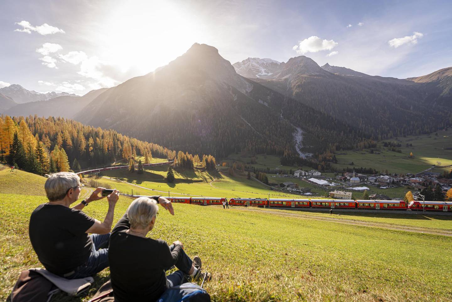 Around 3000 people attended the festival and lined the rails in Bergün to welcome the world's longest passenger train. Photo / Yanik Buerkli, Keystone; AP