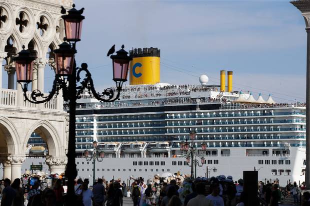 A cruise ship passes by St Mark's Square filled with tourists in Venice, Italy. Photo / AP